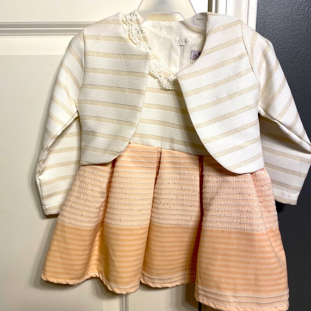 Little baby girl dress in light peach color
